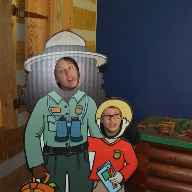 Gloria and a child at a park ranger display in Kentucky