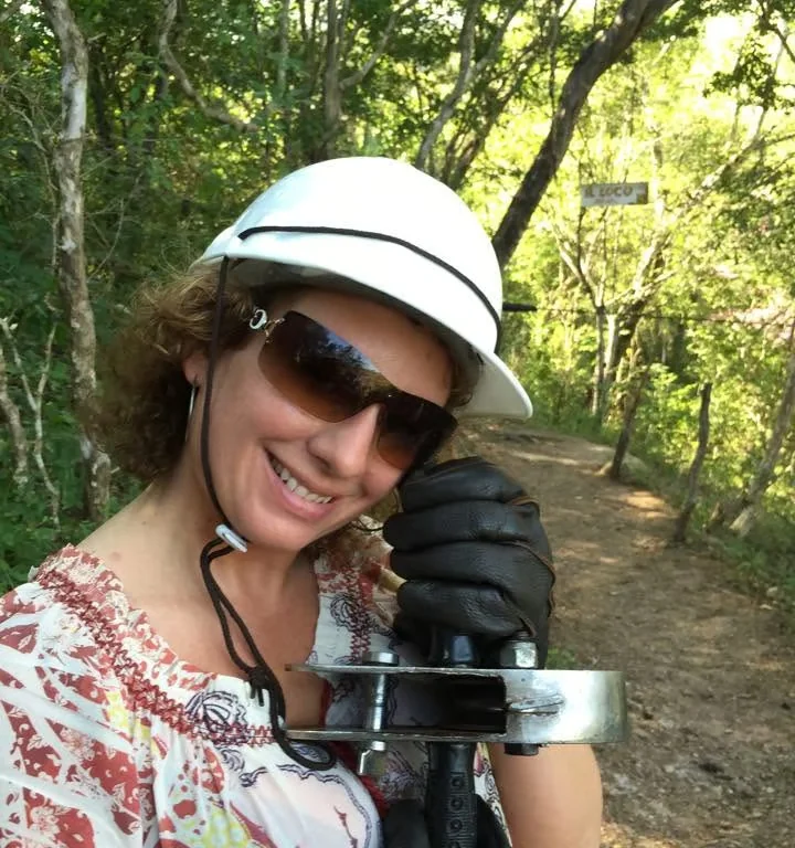 Gloria preparing for a zipline adventure