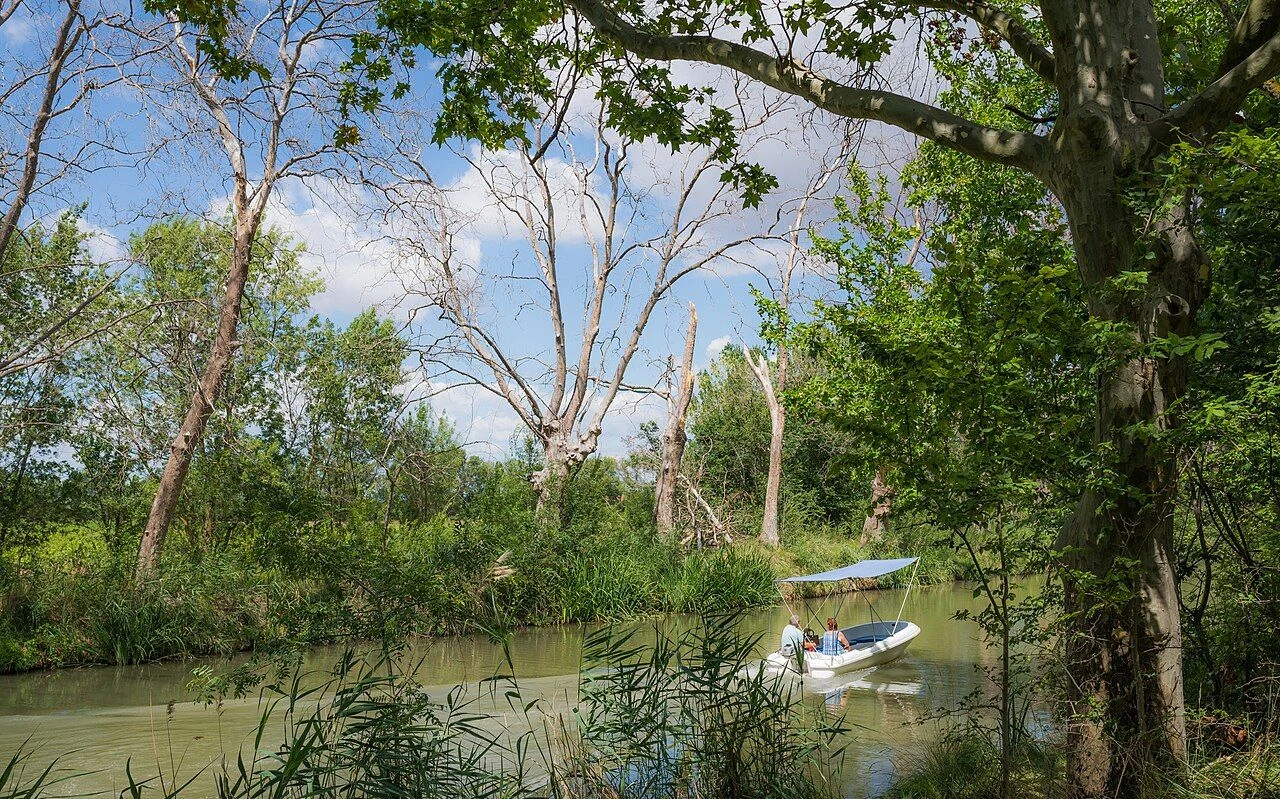 A small boat on the Canal du Midi near Agde, France