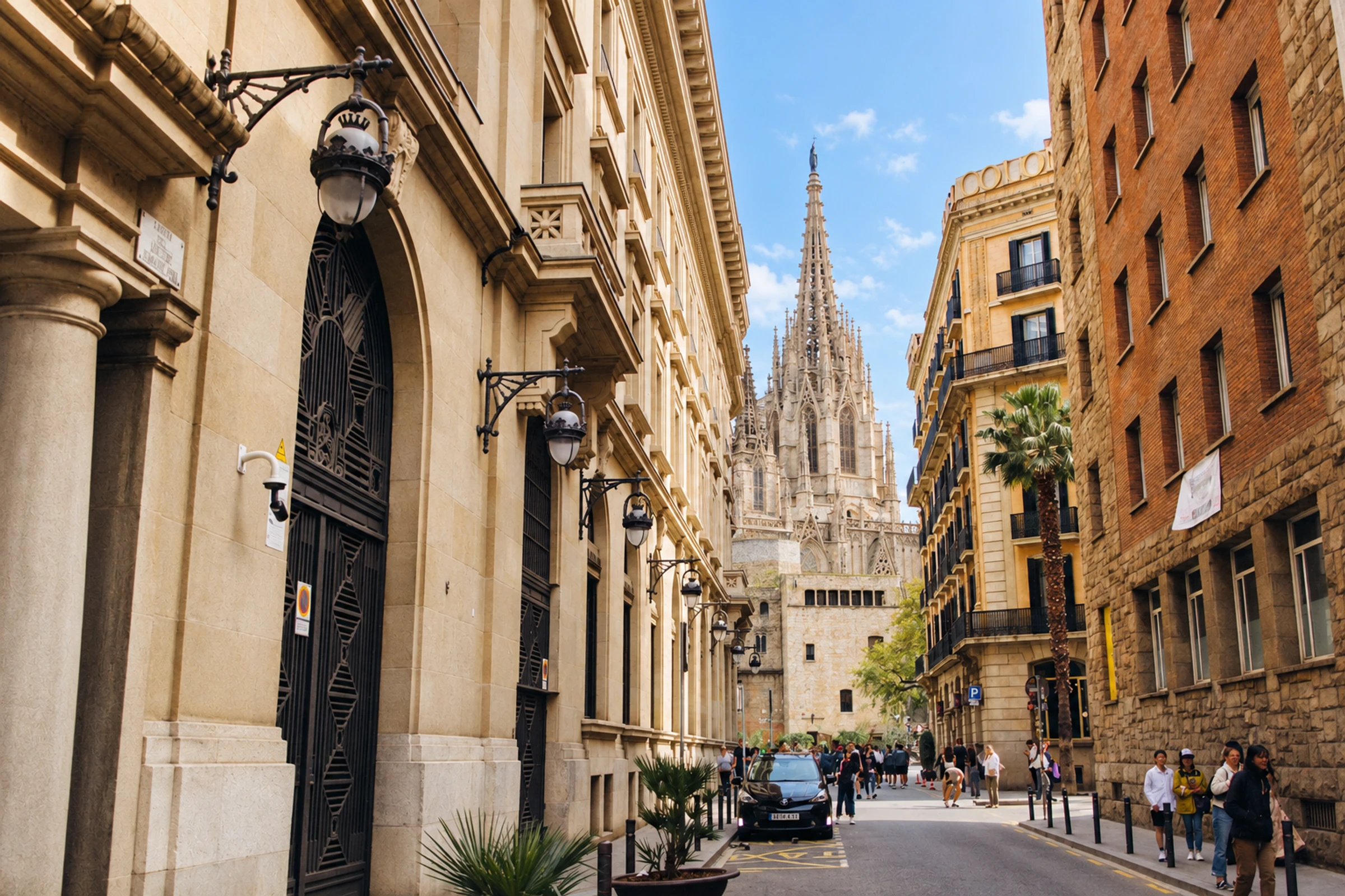 Barcelona street leading toward the Gothic spire of the cathedral