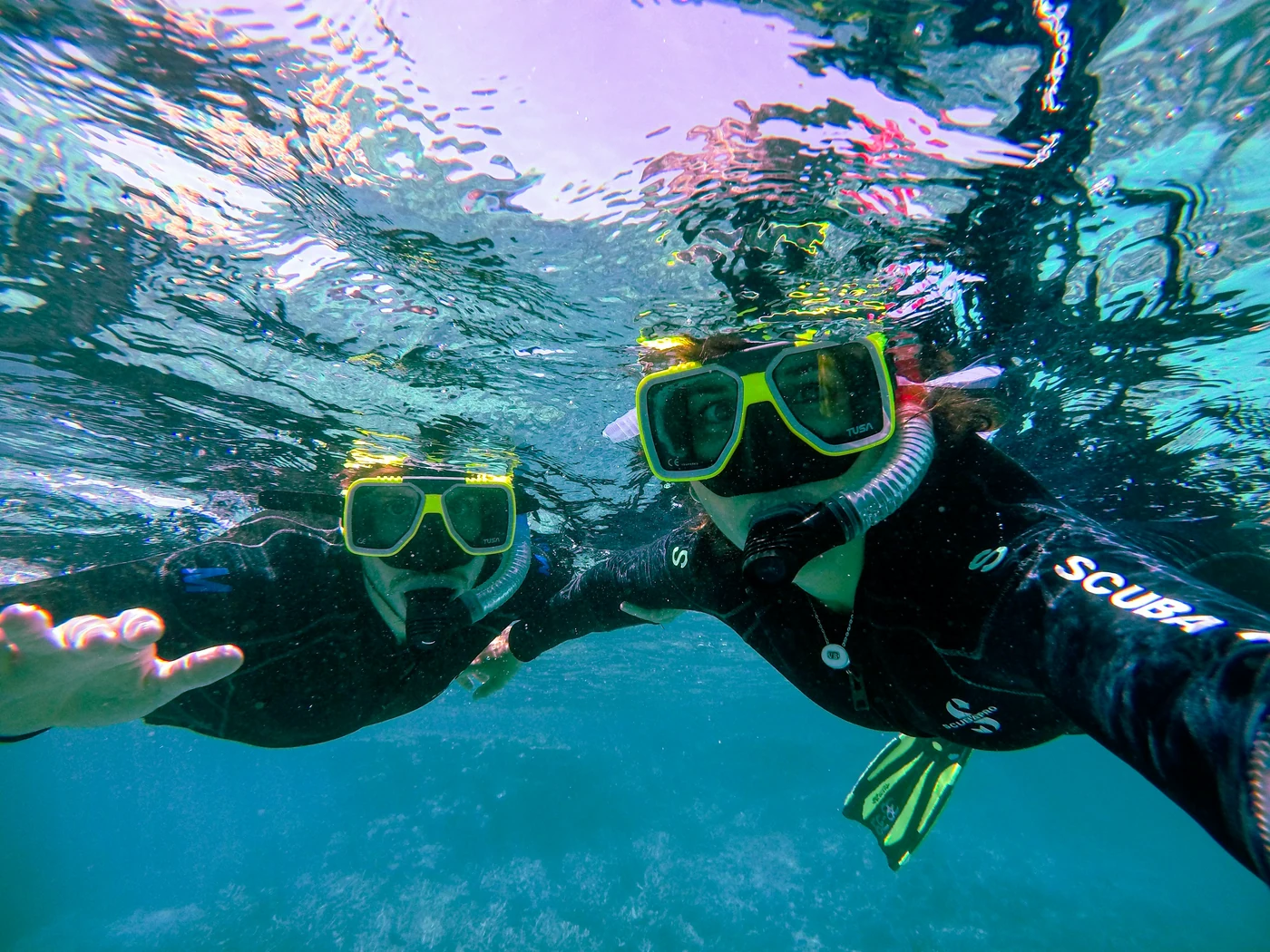 Two snorkelers exploring the waters of the Galápagos Islands
