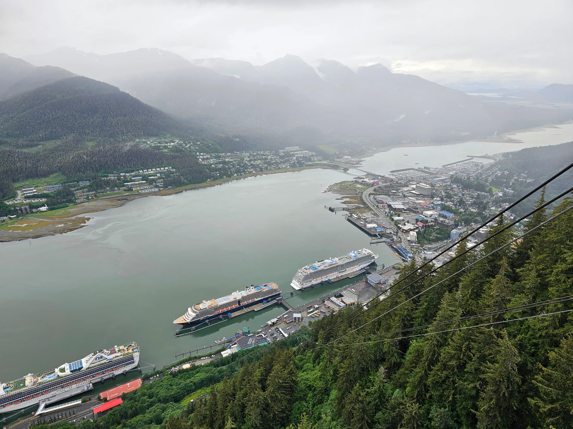 Juneau harbor viewed from above with mountains and cruise ships