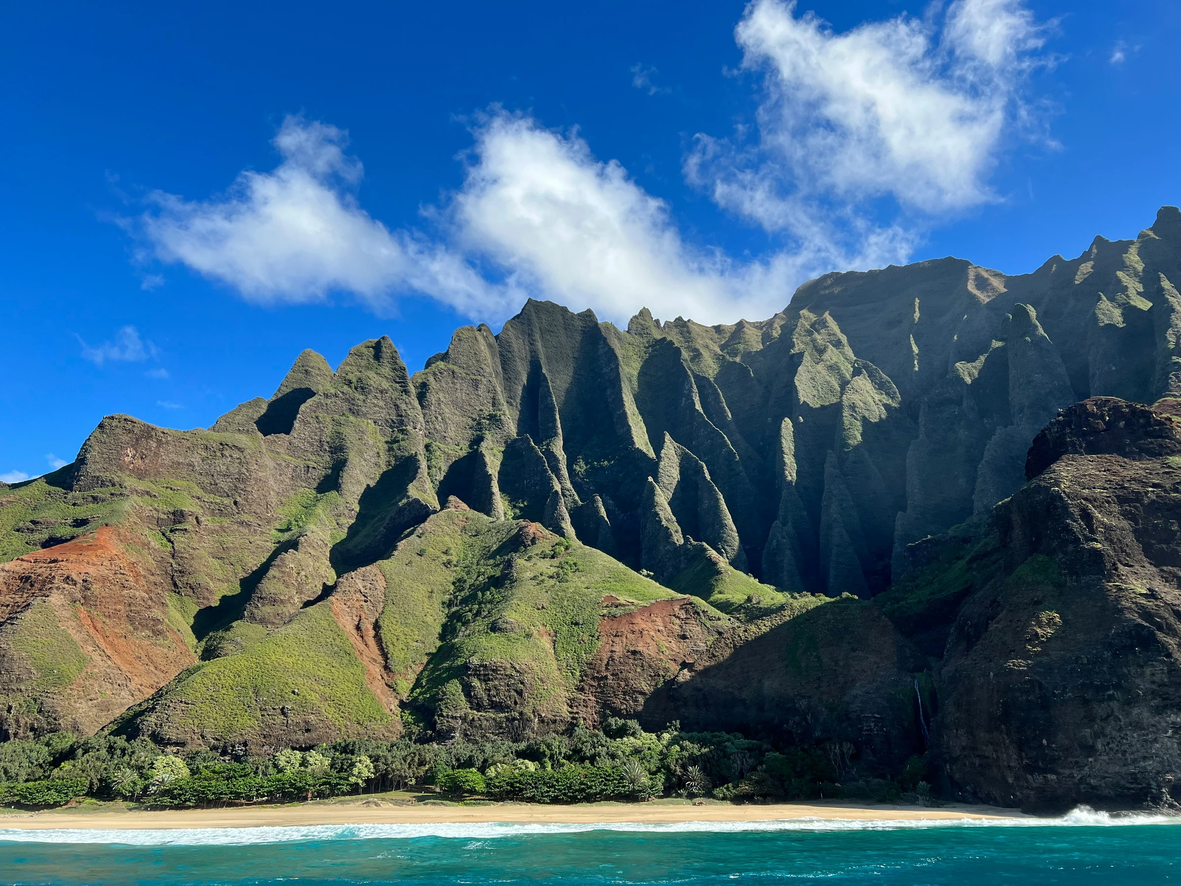 Nā Pali Coast cliffs seen from the water on Kauaʻi