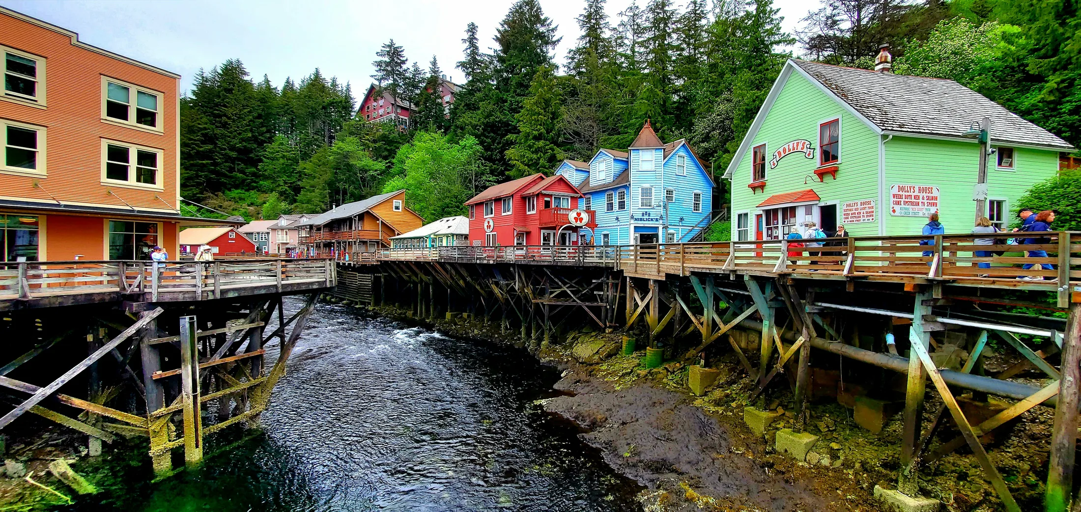 Colorful Creek Street buildings and boardwalk above the water in Ketchikan