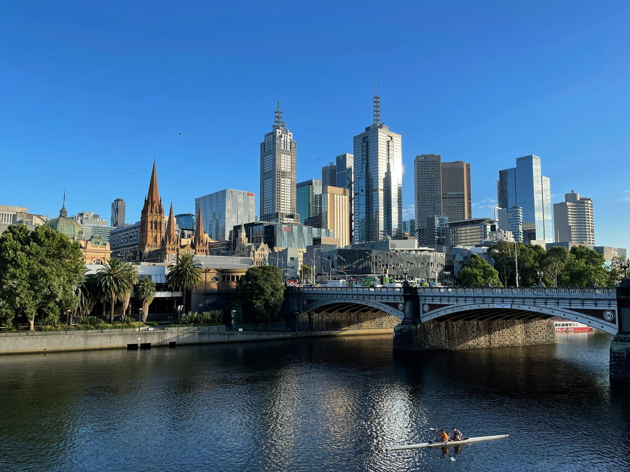 Melbourne skyline and bridge reflected in the Yarra River