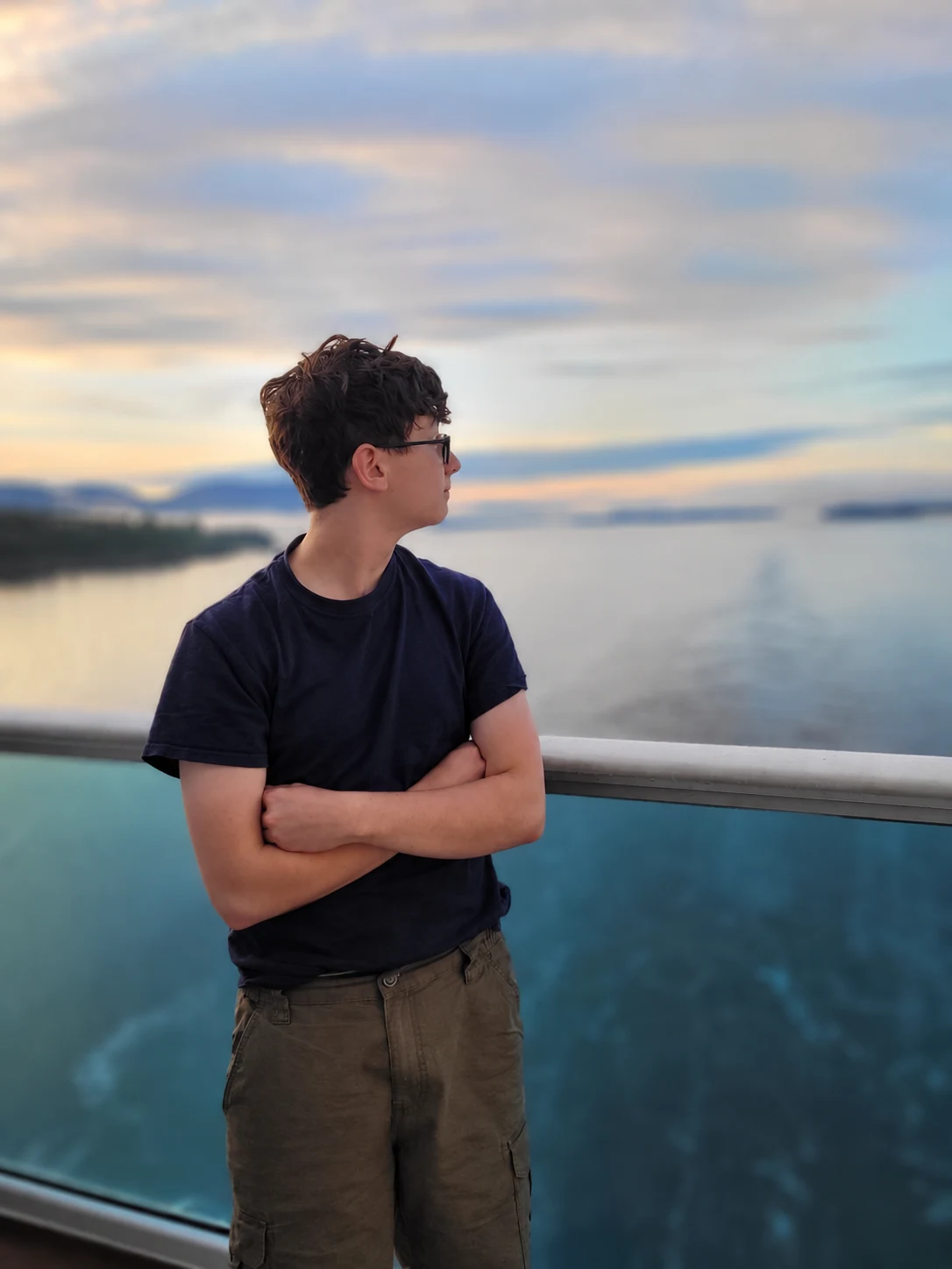 Traveler enjoying the ocean view from a cruise ship balcony