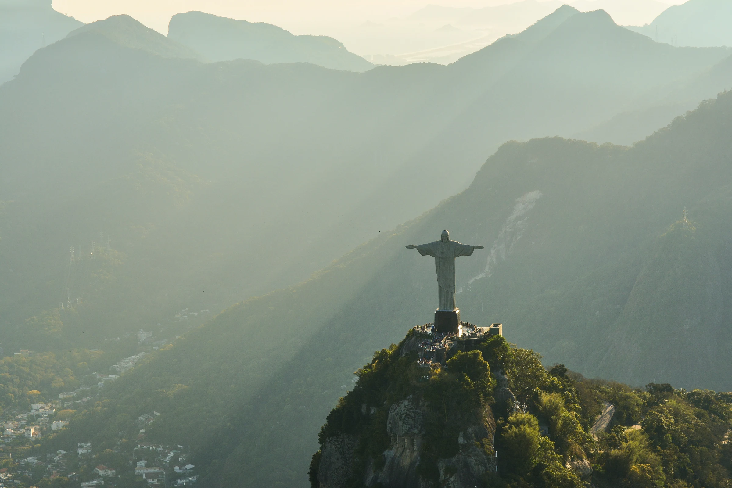 Christ the Redeemer above Rio de Janeiro in hazy golden light