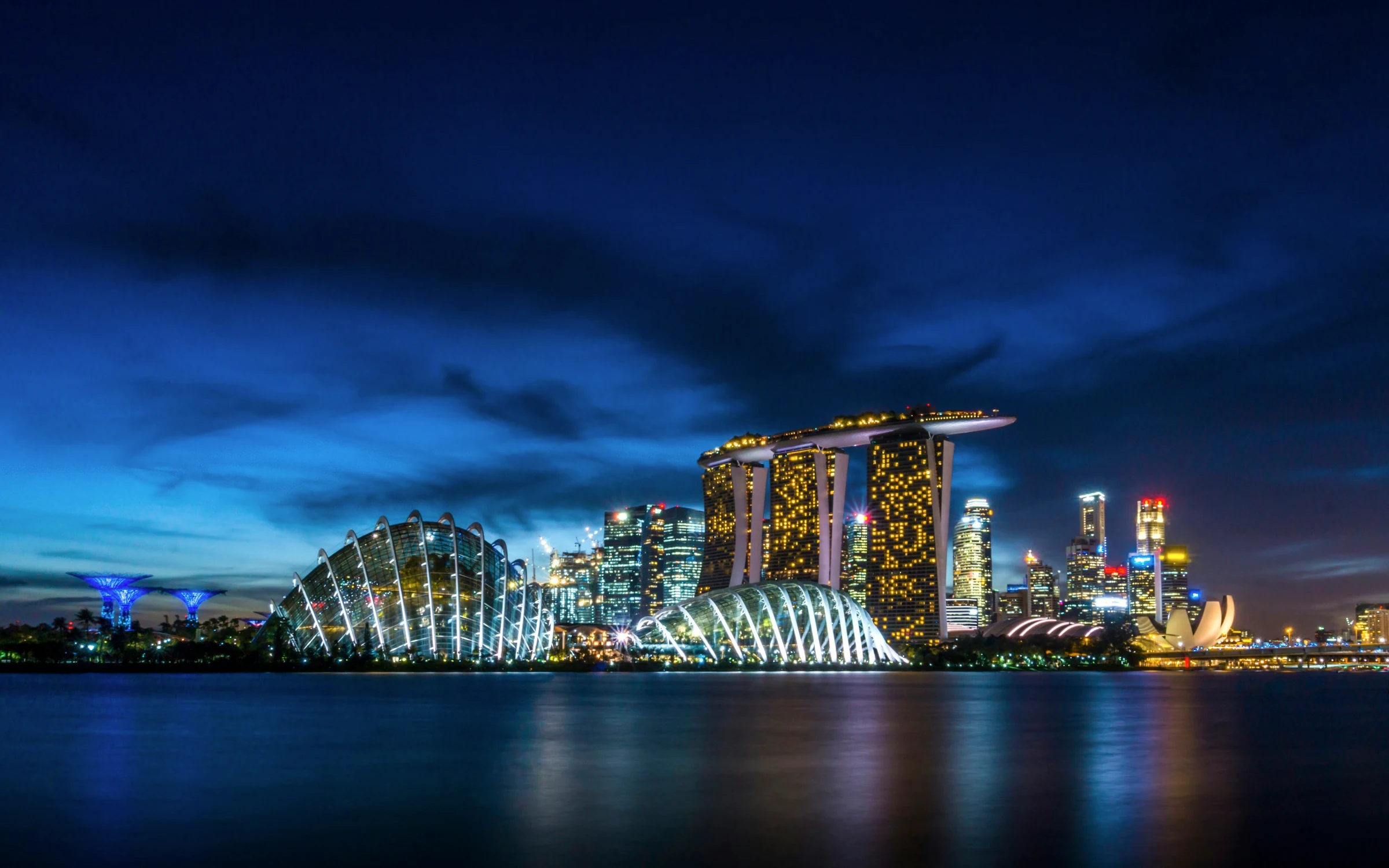 Marina Bay Sands and illuminated waterfront buildings in Singapore at night