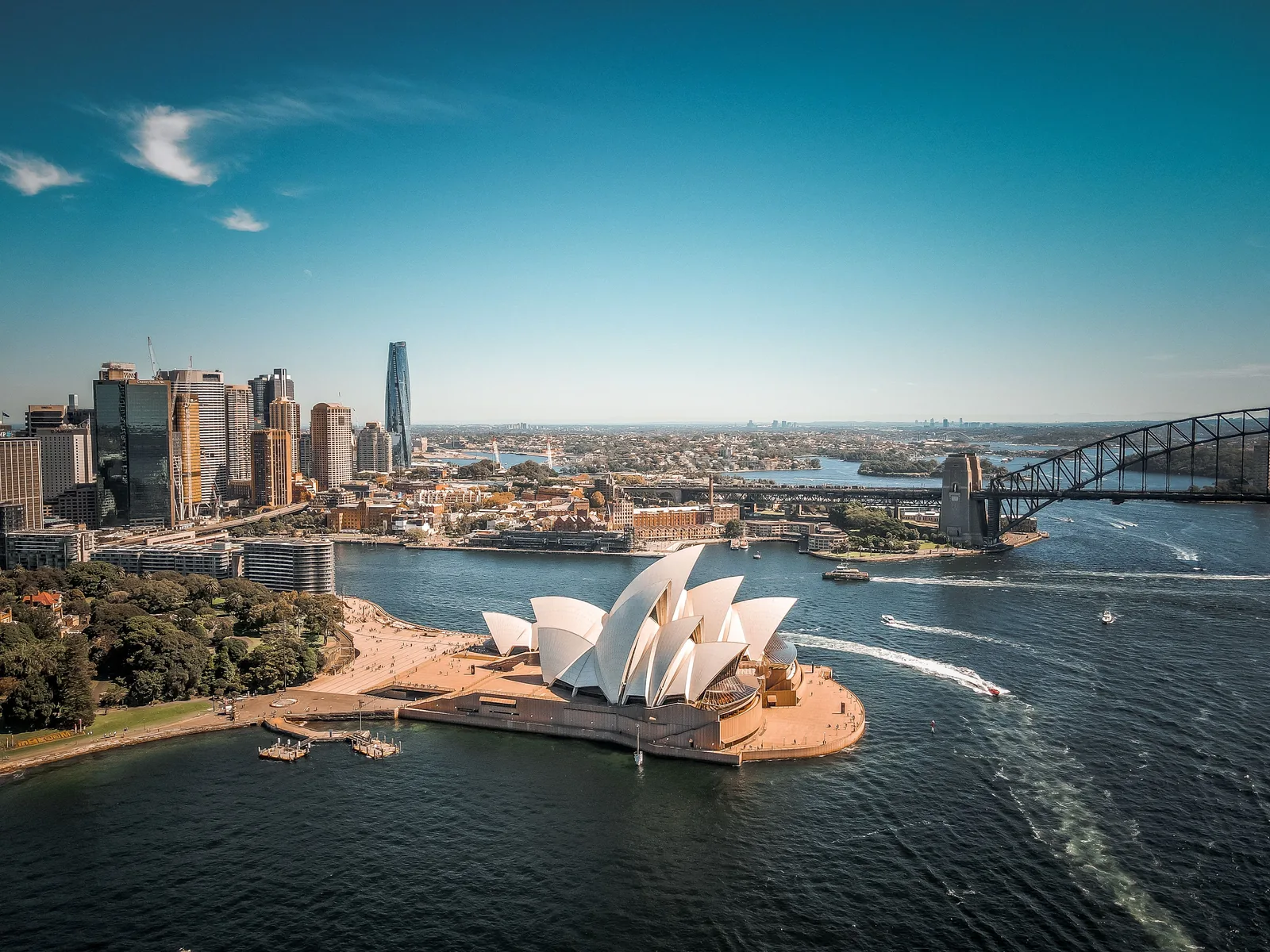 Sydney Opera House and Harbour Bridge beside the harbor