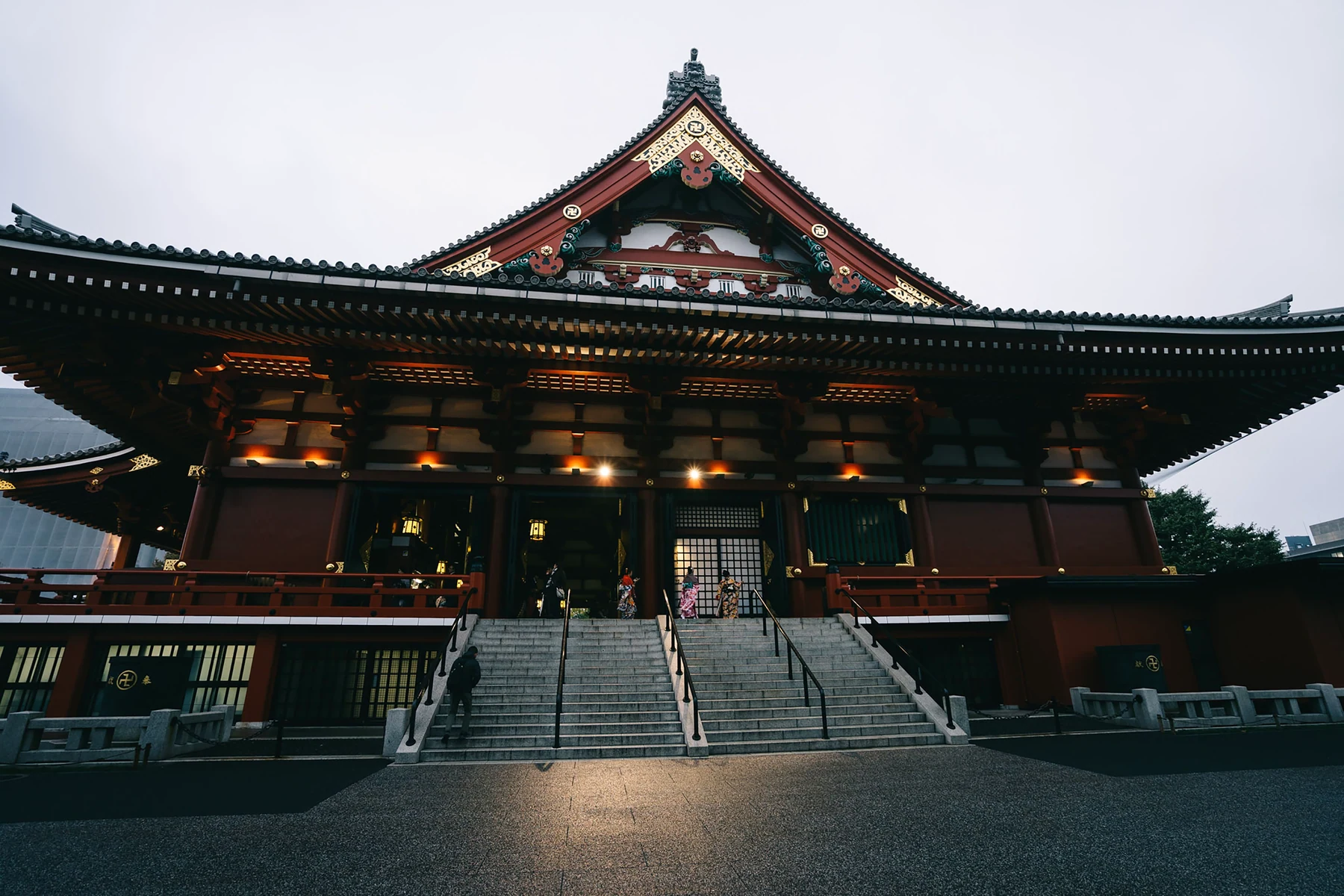 The illuminated main hall and steps of Senso-ji in Tokyo