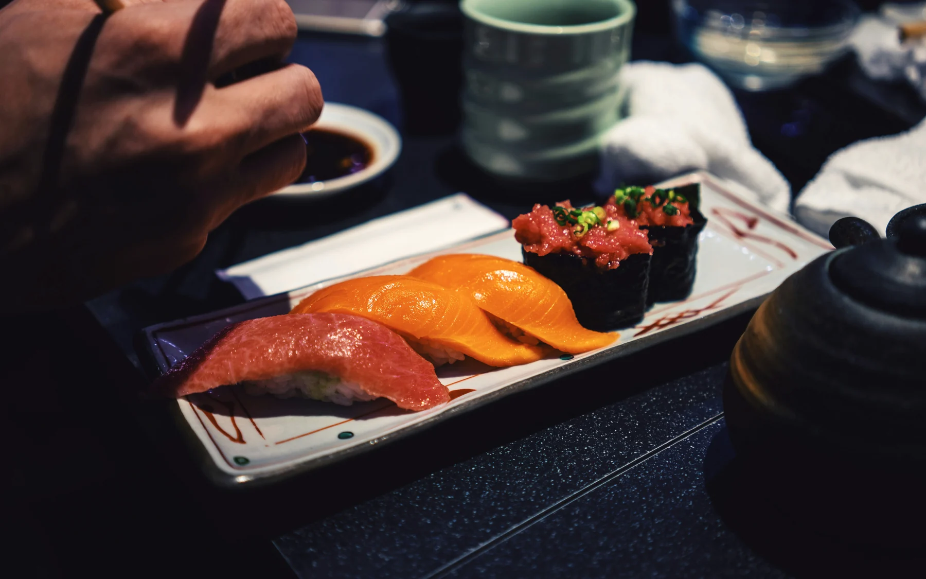 A plate of nigiri sushi photographed in Shibuya, Tokyo