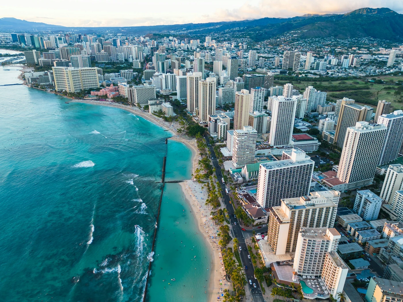 Aerial view of Waikiki beach, Honolulu hotels, and the green ridges of Oahu