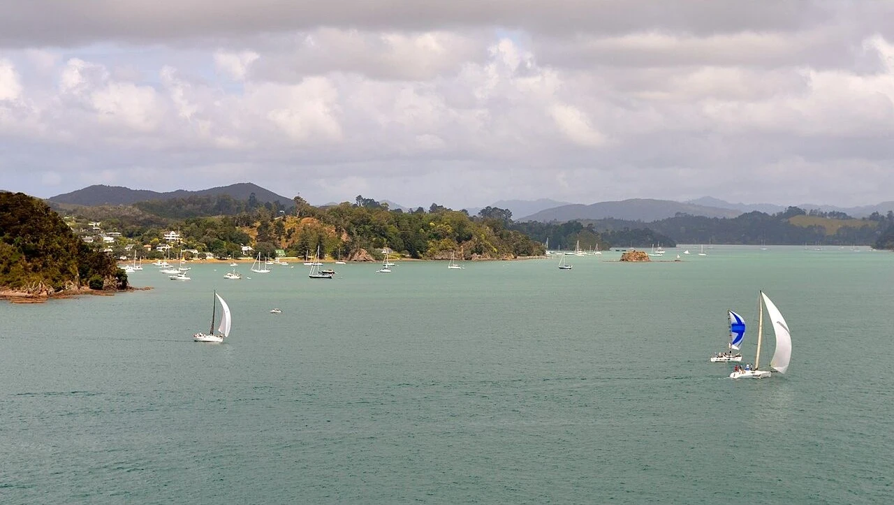 Sailboats on the Bay of Islands with Russell in the background.