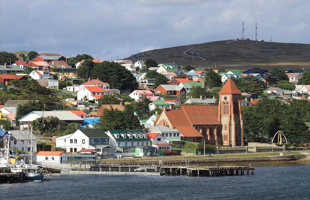 Stanley waterfront with colorful houses and Christ Church Cathedral in the Falkland Islands.