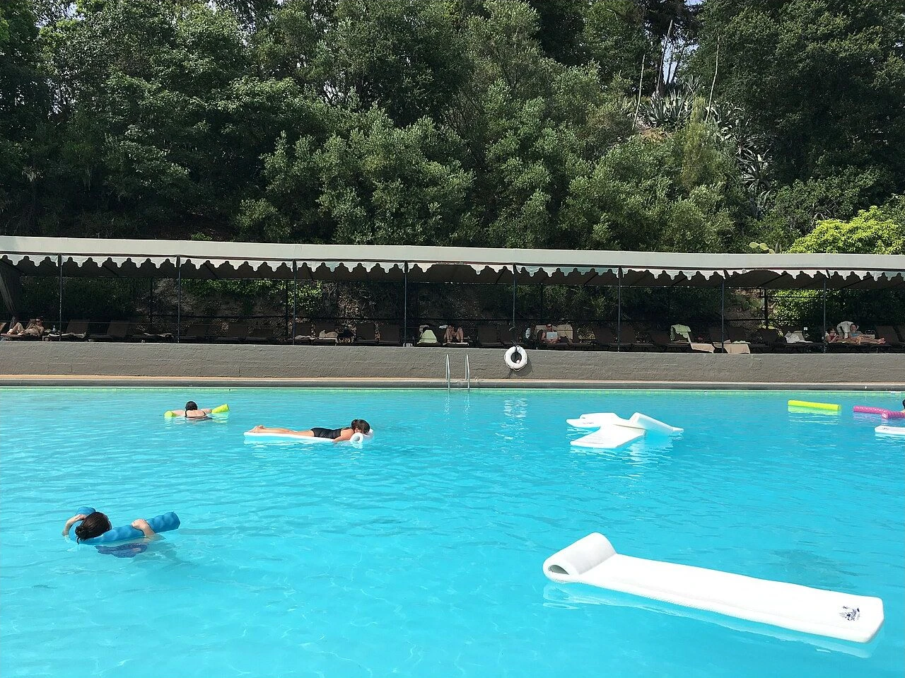Guests relaxing in the main pool at Indian Springs Resort and Spa in Calistoga