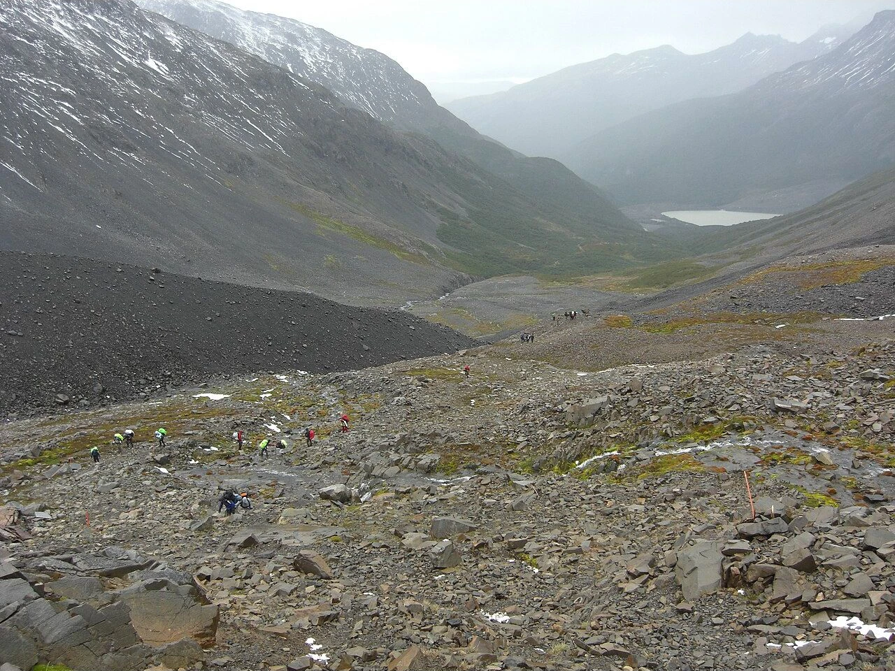 Backpackers on the rocky trail toward John Garner Pass in Torres del Paine