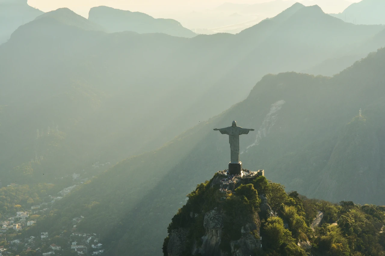 Christ the Redeemer above Rio de Janeiro in hazy golden light
