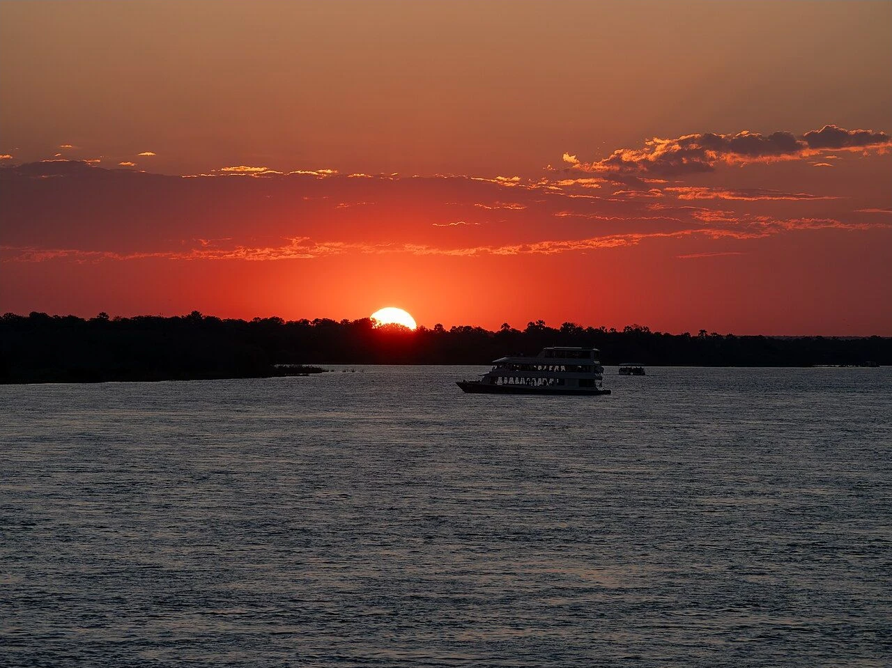 A sunset cruise boat on the Zambezi River above Victoria Falls