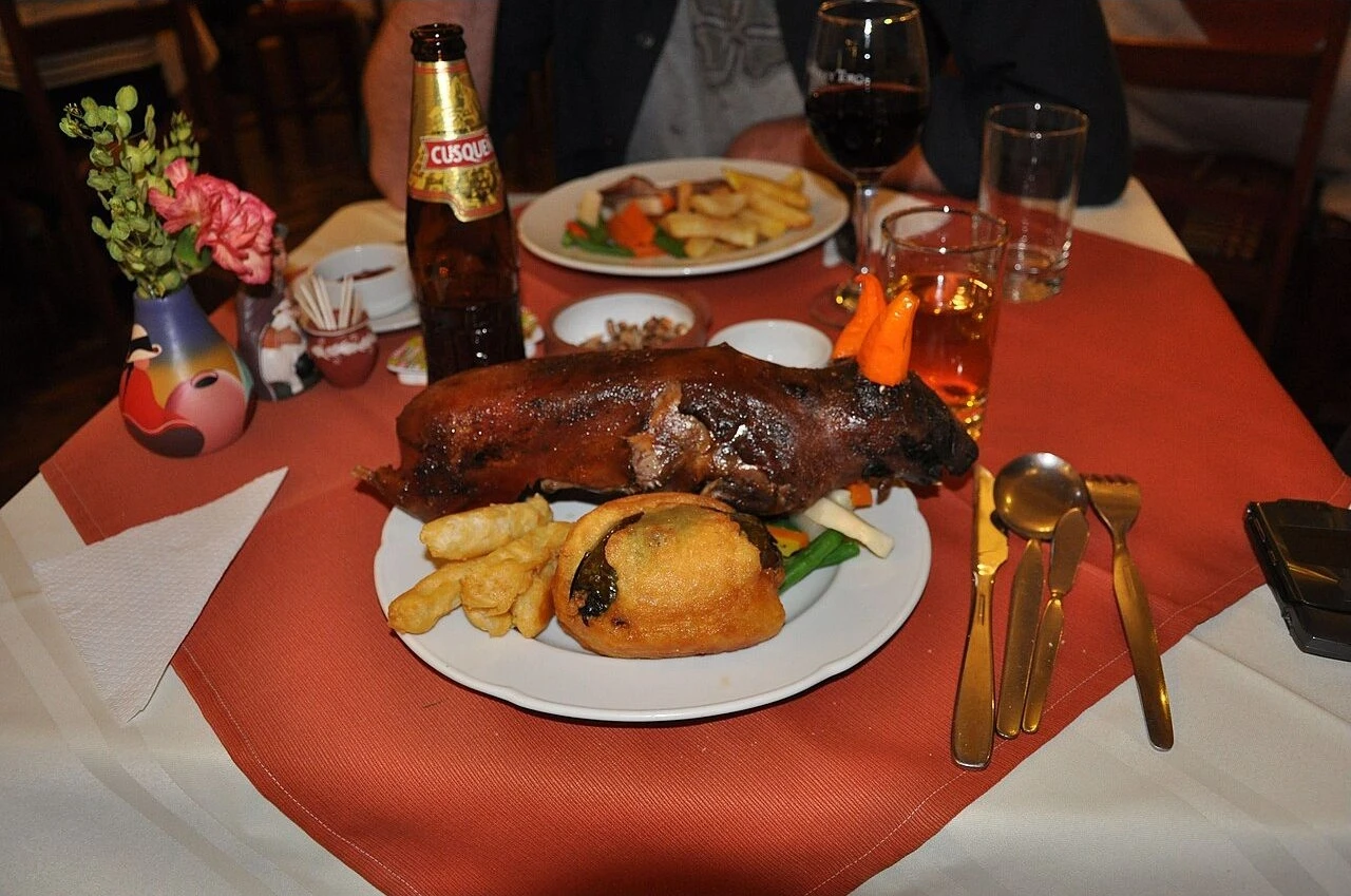 Cuy served with vegetables at a restaurant in Cusco, Peru.