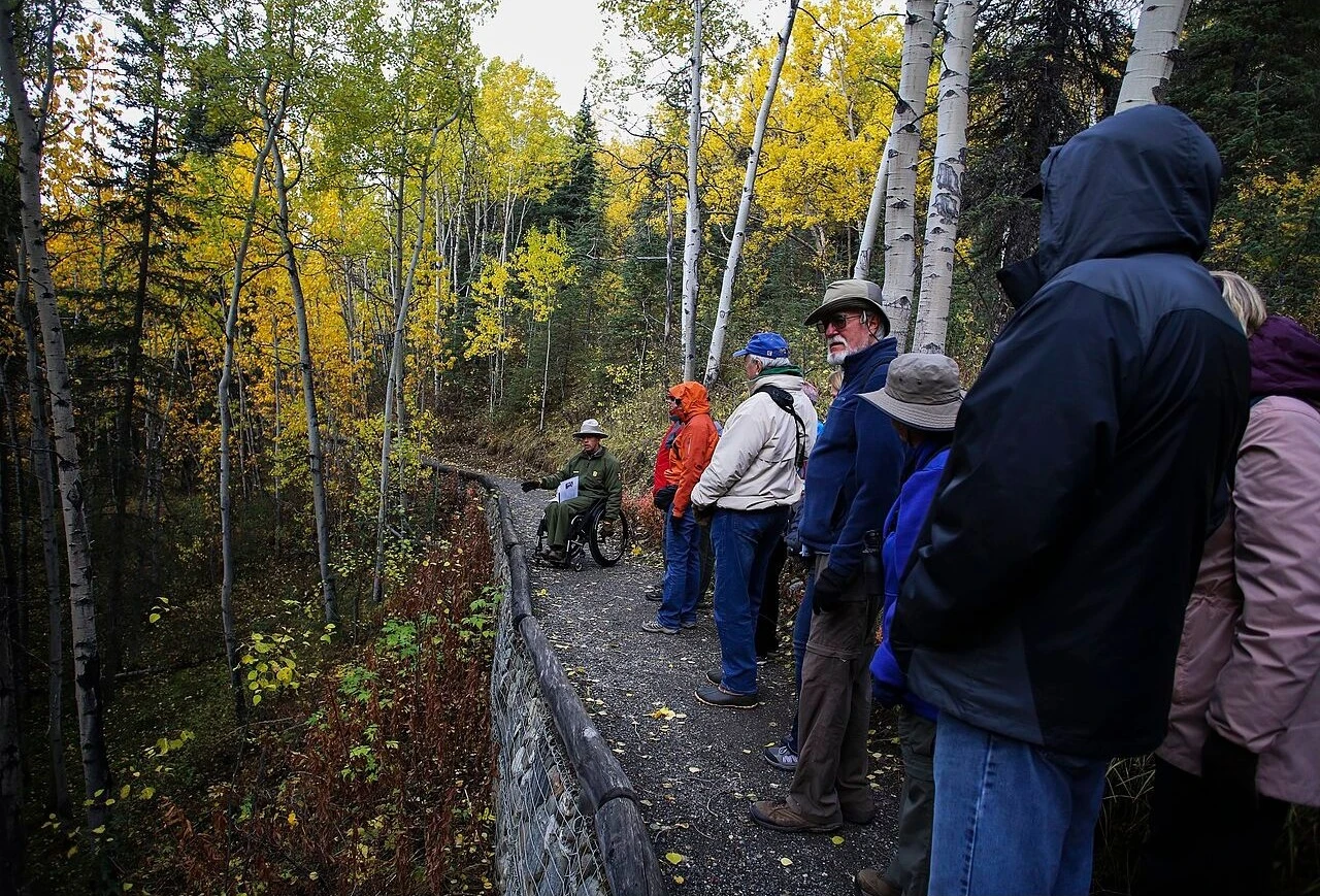 A ranger leads visitors along the McKinley Station Trail in Denali National Park.