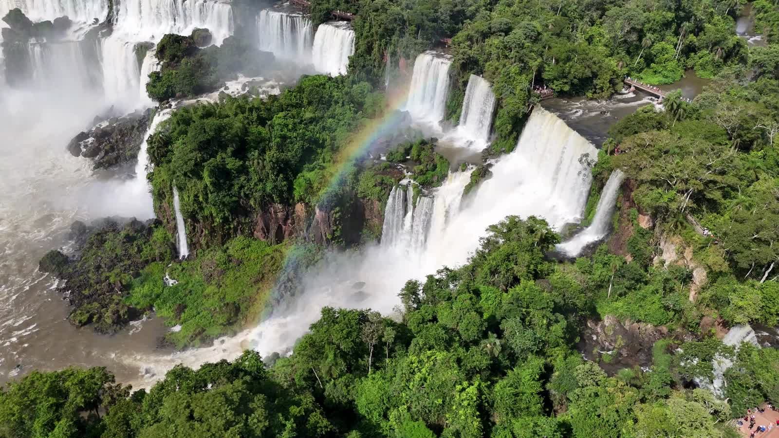 Waterfalls cascading through a lush green landscape