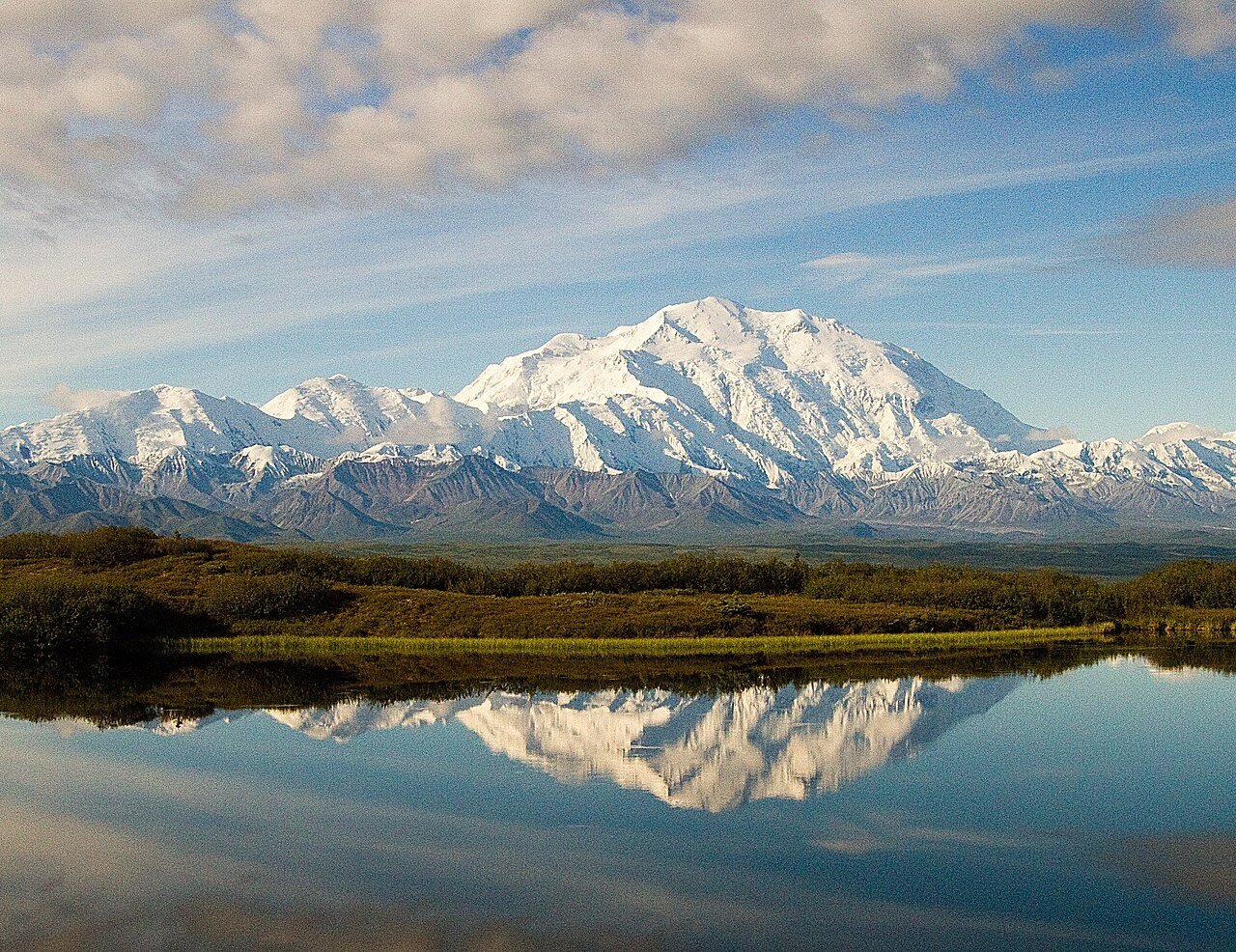 Denali reflected in still water near Wonder Lake, Alaska
